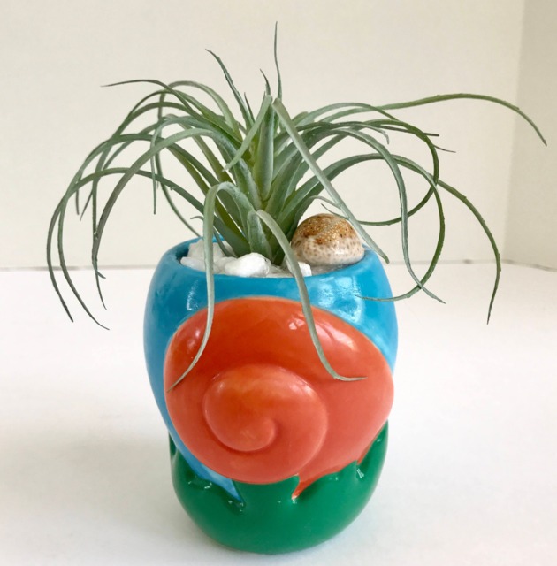 Decorative Planter With Artificial Green Grass Succulent Plant in A Ceramic Seashell - image 1