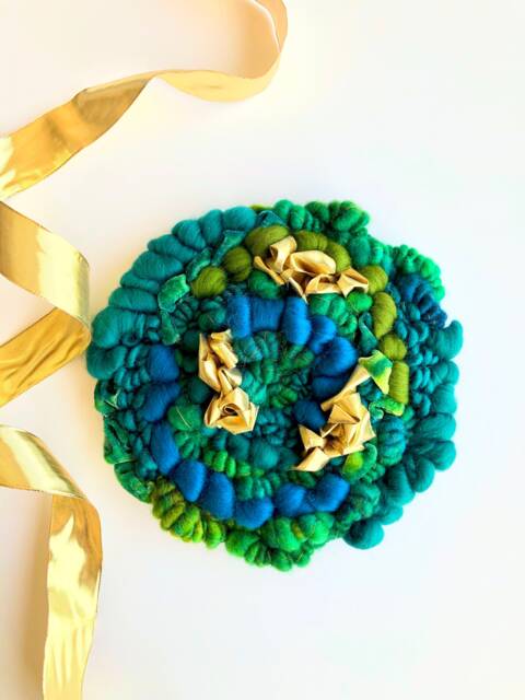 Gilded Clover 10-Inch Round Woven Wall Hanging - image 1