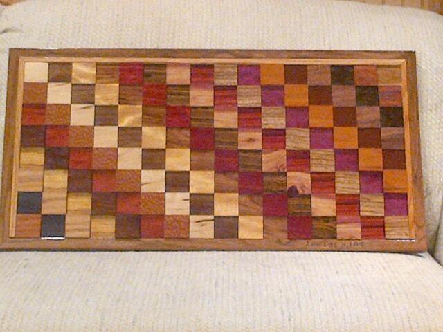 Wood Wall Art Sculpture Featuring A Variety Of Exotic Wood Pieces in Three Dimensional, Geometric Checkerboard-Like Array - image 1