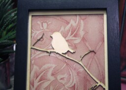 Framed Art. Laser Cut Bird On A Branch With Vintage Wallpaper in Black Frame - thumbnail 1