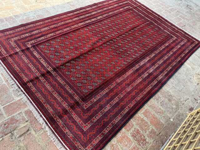 6x9 Handmade Afghan Bukhara Wool Rug in Red - Traditional Oriental Pattern Elegant Area Carpet For Lounge, Dining Space Or Studio - image 1
