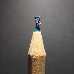 Hand Carved Interlocked Hearts Pencil Sculpture - Glass Dome