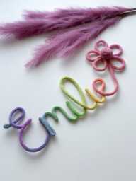 Rainbow Knitted Name Sign Nursery Decor With Flower & Pom-Pom - thumbnail 1