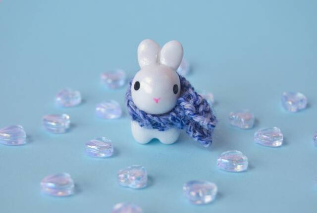 Opalescent Bunny Figurine With Hand Knit Scarf - image 1