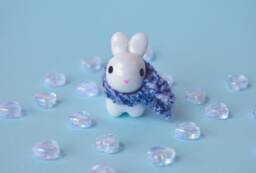 Opalescent Bunny Figurine With Hand Knit Scarf - thumbnail 1