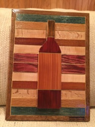 Wood Wall Art Sculpture Featuring A Hand Cut Wine Bottle Set in Oak & Hardwood Pieces Stained Variety Of Colors