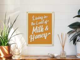 Living in The Land Of Milk & Honey Felt Banner - Vintage Home Decor, Inspirational Poster, Motivational Quote Art, Retro Gift - thumbnail 1