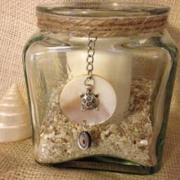 Green-Tinted Square Sun-Patterned Glass Candleholder With Metallic Sea Turtle & Shell Pendant