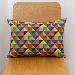 "Geometric Tapestry Double Sided Boudoir Cushion. Multicoloured Red Blue Green Yellow Triangular Harlequin Patten. 17""x12"