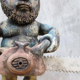 Ceramic Garden Gnome With A Chainsaw - thumbnail 2