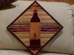 Wood Wall Art Sculpture Featuring A Hand Cut Wine Bottle Set in Oak & Pine Beveled Trim Strips Stained Variety Of Colors