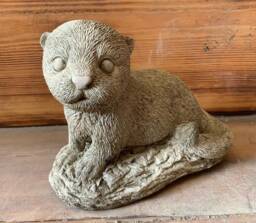 Stone Garden Laying Baby Otter Statue Ornament - thumbnail 1