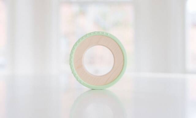 Silicone Wrapped Wooden Baby Ring Toy - Honeydew - image 1