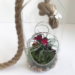 Hanging Glass Vase With Artificial Grass Succulent & A Purple Butterfly - thumbnail 3