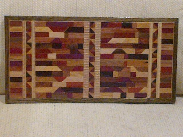 Wood Wall Art Sculpture Featuring A Variety Of Exotic Wood Pieces in Geometric Array With Triangle Inlays - image 1