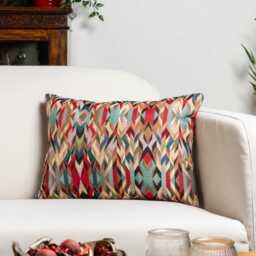 Nomad Tapestry Boudoir Cushion. Geometric Angular Design in Red, Green, Lilac Purple, Teal Blue & Charcoal Grey. 17x12