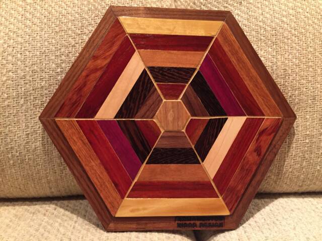 Hexagon Shaped Wood Wall Art Sculpture Featuring A Variety Of Exotic Pieces Geometrically Arrayed - image 1