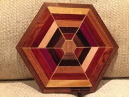 Hexagon Shaped Wood Wall Art Sculpture Featuring A Variety Of Exotic Pieces Geometrically Arrayed