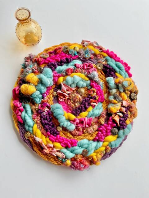 Carnival 14-Inch Round Woven Wall Hanging - image 1