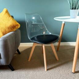 "Fusion Living Soho Clear and Black Plastic Dining Chair with Squared Light Wood Legs - interlock "