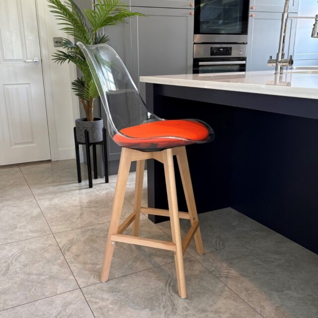 "Fusion Living Soho Clear and Orange Plastic Bar Stool with Light Wood Legs "