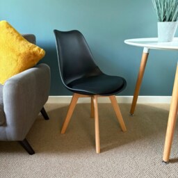 "Fusion Living Soho Black Plastic Dining Chair with Squared Light Wood Legs - interlock "