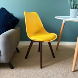 "Fusion Living Soho Yellow Plastic Dining Chair with Squared Dark Wood Legs - interlock "