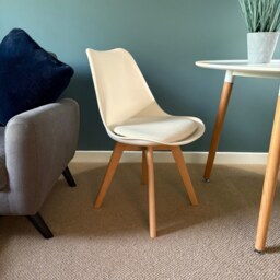"Fusion Living Soho Vanilla Plastic Dining Chair with Squared Light Wood Legs - interlock "