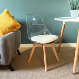 "Fusion Living Soho Clear and Vanilla Plastic Dining Chair with Squared Light Wood Legs - interlock "