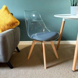 "Fusion Living Soho Clear and Dark Grey Plastic Dining Chair with Squared Light Wood Legs - interlock "