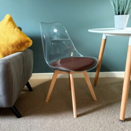"Fusion Living Soho Clear and Chocolate Plastic Dining Chair with Squared Light Wood Legs - interlock "