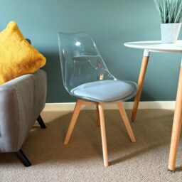 "Fusion Living Soho Clear and Light Grey Plastic Dining Chair with Squared Light Wood Legs - interlock "