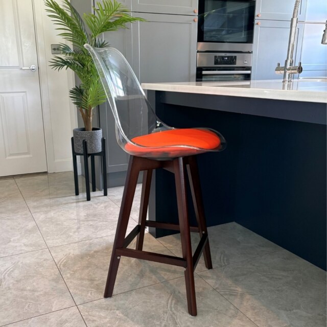 "Fusion Living Soho Clear and Orange Plastic Bar Stool with Dark Wood Legs "