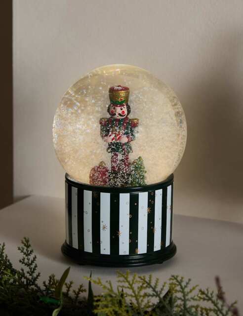 M&S Light Up Musical Nutcracker Snow Globe Red Mix by Marks