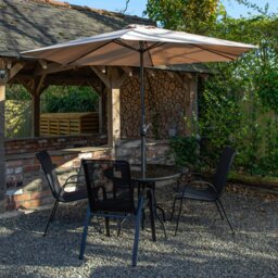 Rackhams Outdoor 4 Person Round Glass Top Garden Dining Table Chairs With Beige Parasol and Base Set - Outdoor Furniture Sets
