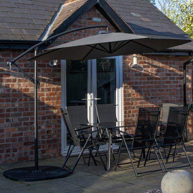 Rackhams Outdoor 6 Person Rectangular Glass Top Garden Dining Table Chairs With Grey Banana Parasol and Base - Outdoor Furniture Sets - image 1