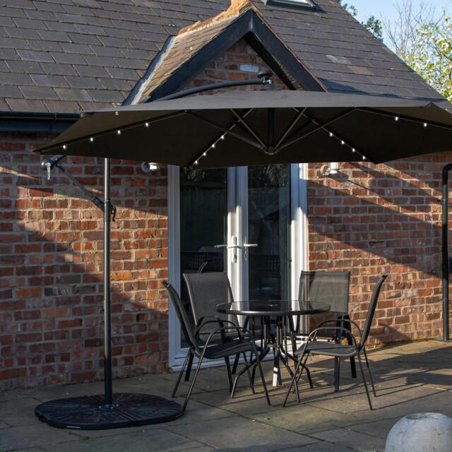Rackhams Outdoor 4 Person Round Glass Top Garden Dining Table Chairs With Black Banana Lit Parasol and Base - image 1