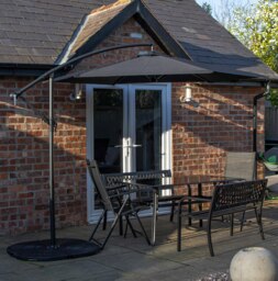 Rackhams Outdoor 6 Person Rectangular Glass Top Garden Dining Table Benches & Chairs With Black Banana Parasol and Base - Outdoor Furniture Sets