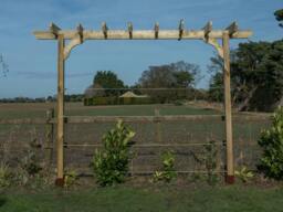 Rackhams Chamfered Single Beam Pergola, Plant Climbing Arbour - Sculpted brace - Rustic Brown - Three Row Kit - 1.8m - thumbnail 4