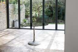 Rackhams Swan Circular Dining Table with Concrete Base - Concrete - Brass - Black Glass - thumbnail 3