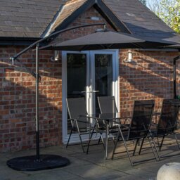 Rackhams Outdoor 4 Person Rectangular Glass Top Garden Dining Table Chairs With Black Banana Parasol and Base - Outdoor Furniture Sets - thumbnail 1