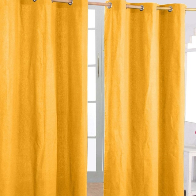 Homescapes Cotton Plain Mustard Yellow Ready Made Eyelet Curtain Pair - 117 x 137 cm Yellow Mustard Yellow (W) 117cm x (L) 137cm