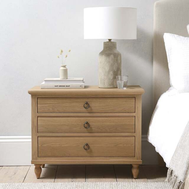 Elkstone Mellow Oak Large 3 Drawer Bedside Table - The Cotswold Company - image 1