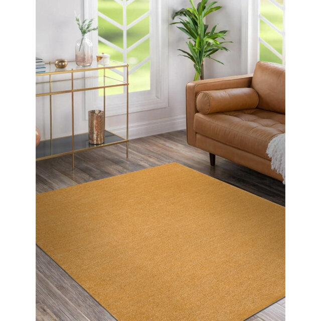 Basri No Pattern Machine Woven Gold Area Rug