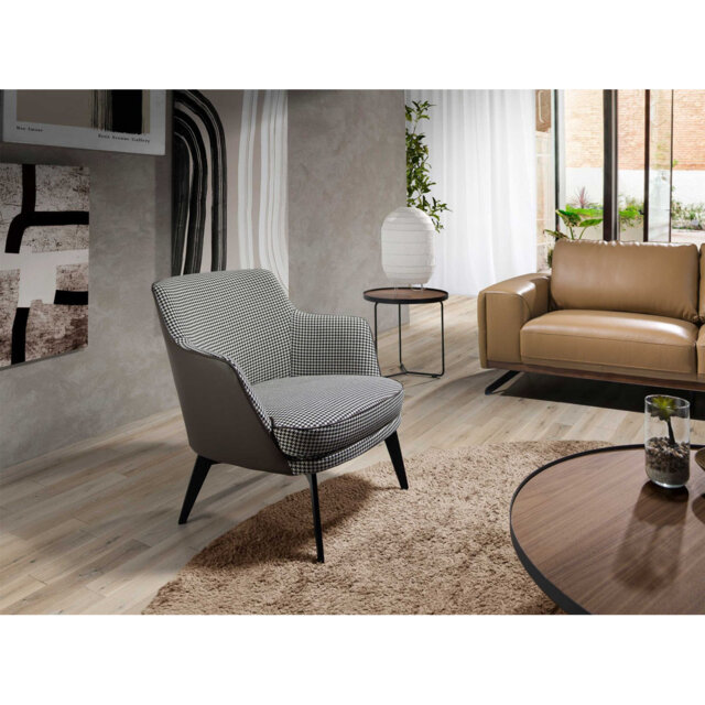 Black and white fabric and chocolate brown leatherette armchair