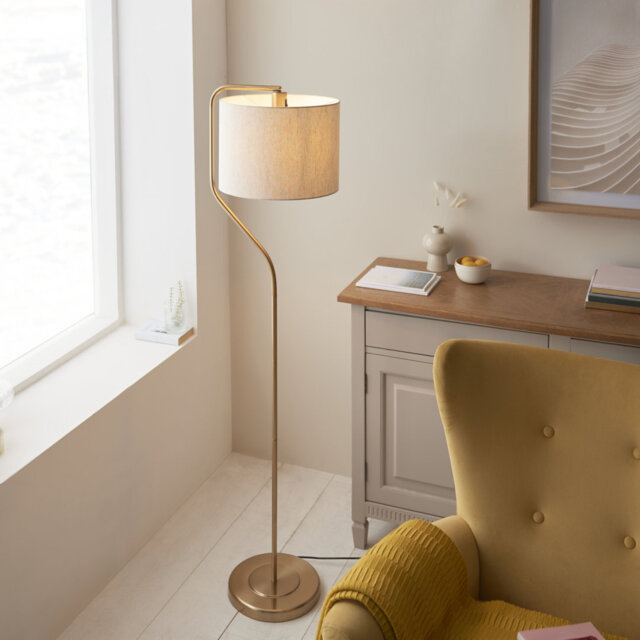 Clement Floor Lamp finished in Warm Brass and Natural