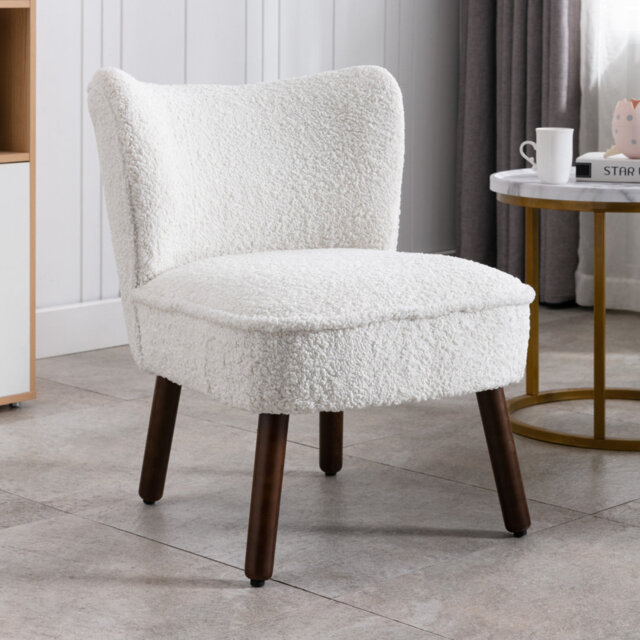 Armchair made of teddy fabric with wooden legs, white