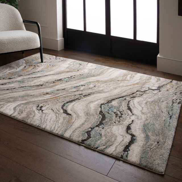 Decara Wave Abstract High-Low Blue/Beige/Ivory Area Rug