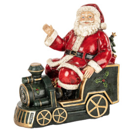 Santa Riding Xmas Train Figurine
