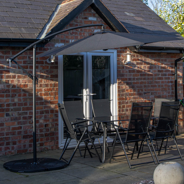 Samuel Alexander 6 Seater Rectangular Outdoor Dining Set with Black Banana Parasol and Base - Wilko - image 1